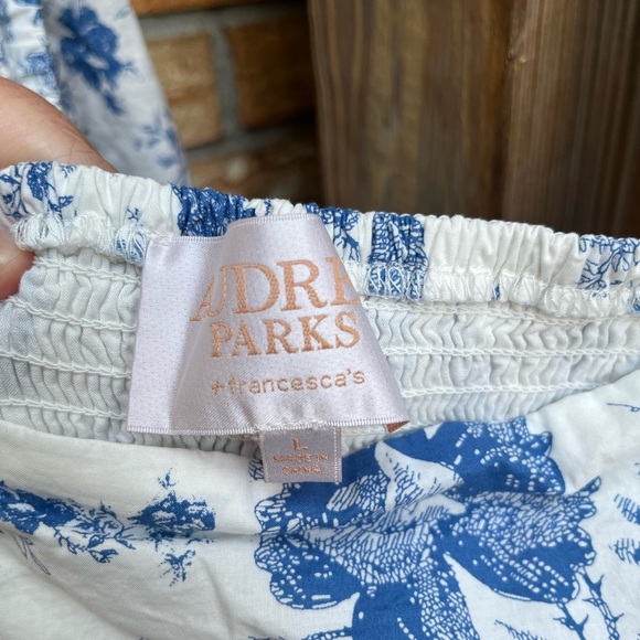 Francesca's Collections Blue and White Floral Jumpsuit with Puff Sleeves - Picture 2 of 3